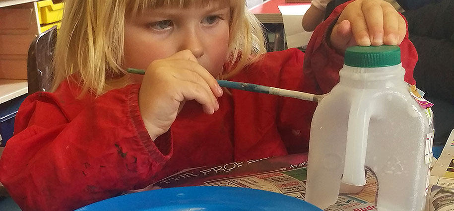 Radbrook Nursery home image 4 young girl painting a bottle